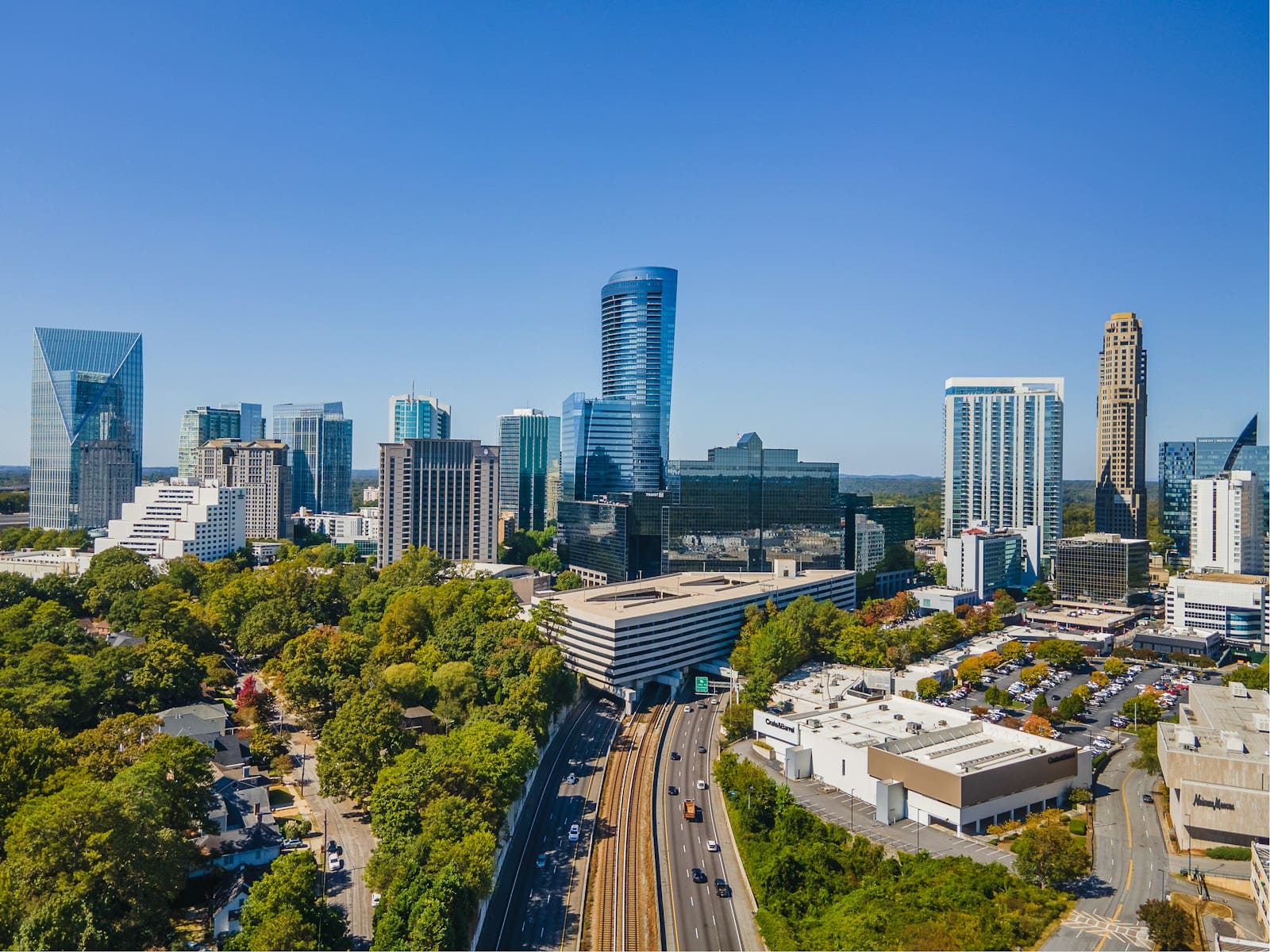 An aerial view of a city with tall buildings